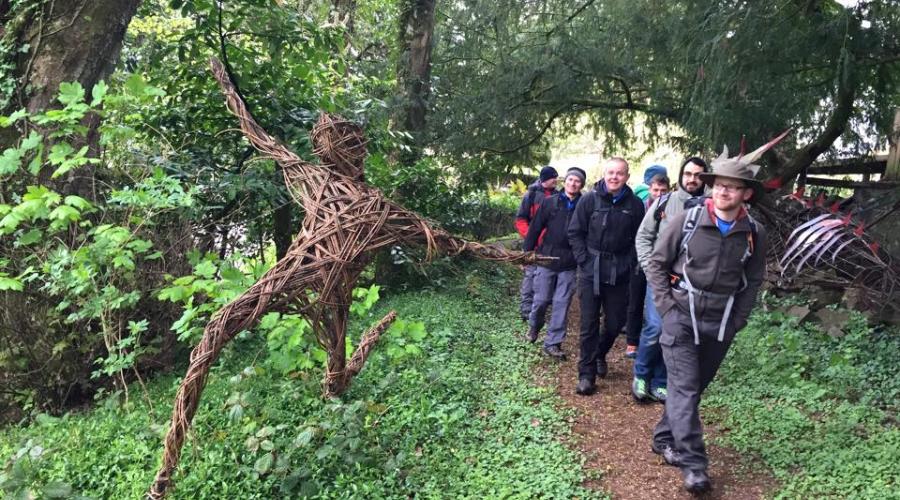 Sculpture Trail featuring a willow 'prancing man', as Outdoorlads set off on a day walk from Penpont